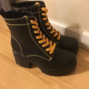 Black and yellow platform boots